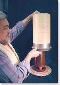 Sprued wax impression is placed in a flask